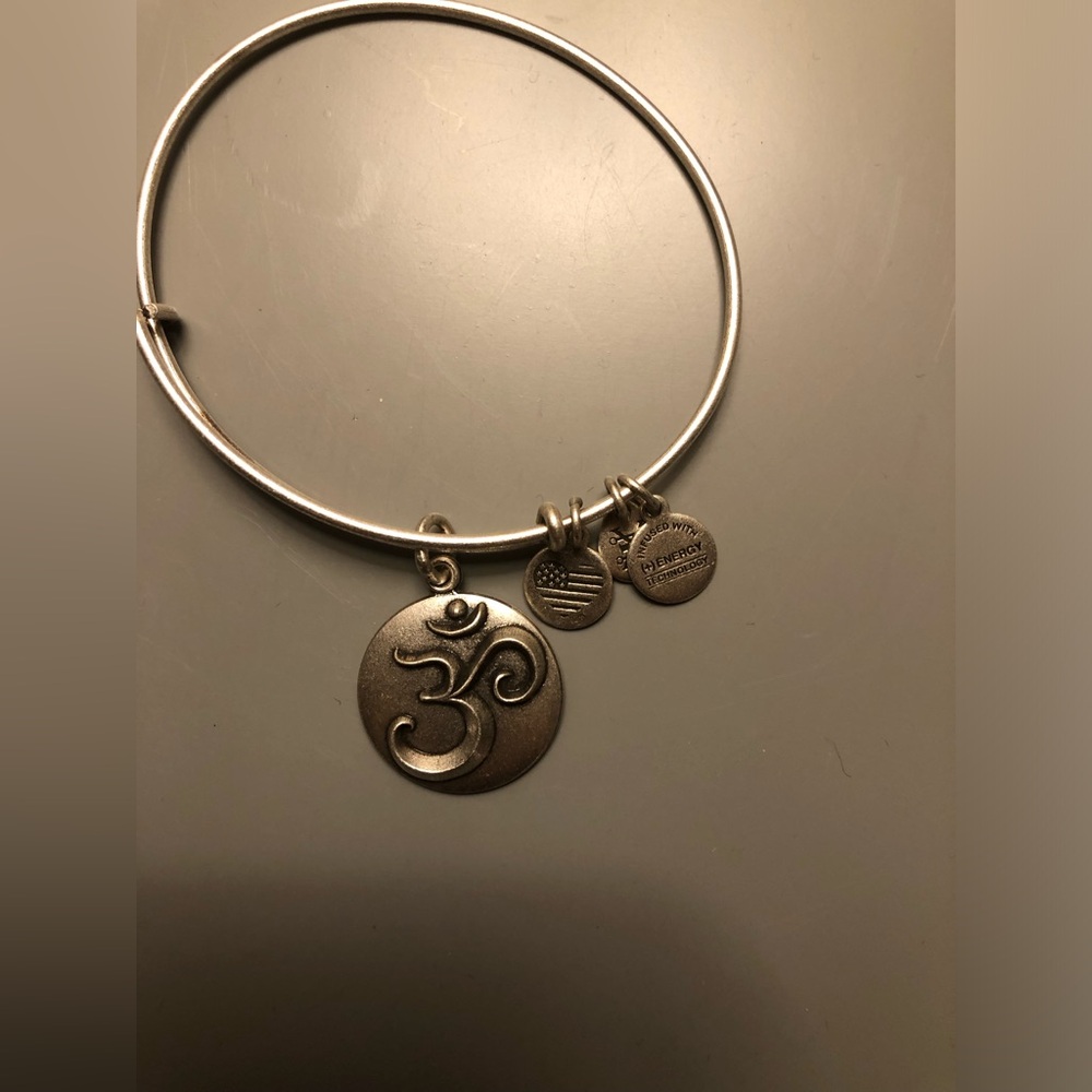Alex and Ani silver OHM adjustable bangle. Looks great worn in a “stack”
